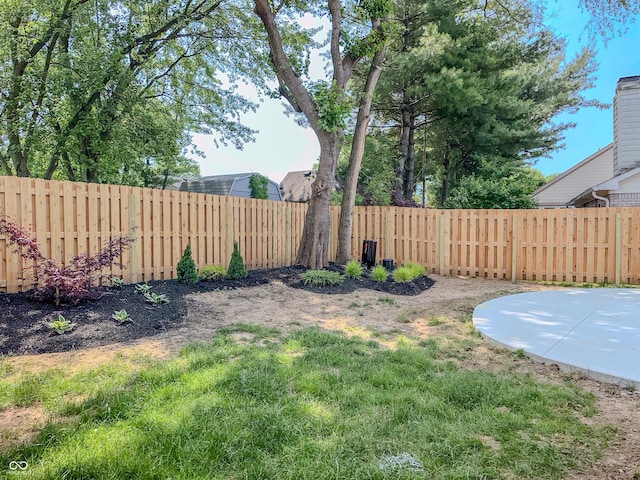 6845 Arjay Dr, Indianapolis, IN 46217 - fenced backyard featuring a patio