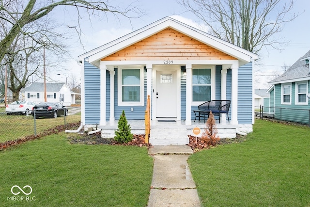 2209 W 9th St, Muncie, IN 47302 - shotgun-style home featuring a porch
