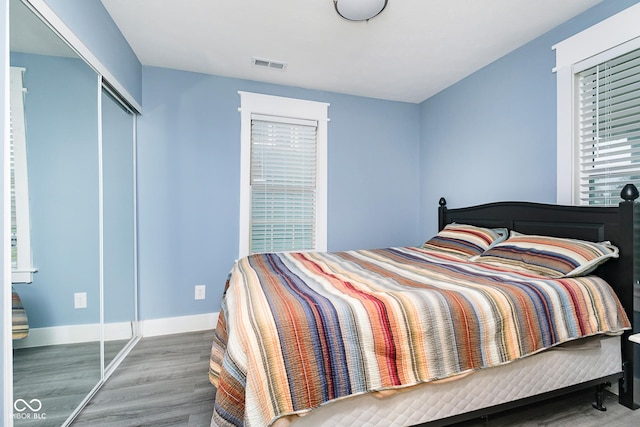 2209 W 9th St, Muncie, IN 47302 - bedroom with wood finished floors, baseboards, and a closet
