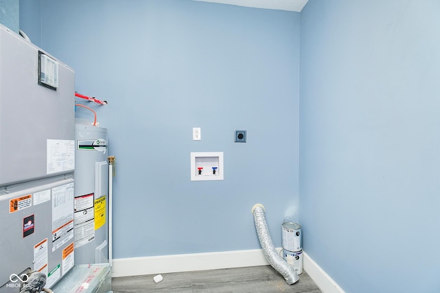 2209 W 9th St, Muncie, IN 47302 - laundry room with hookup for an electric dryer, wood finished floors, baseboards, heating unit, and hookup for a washing machine