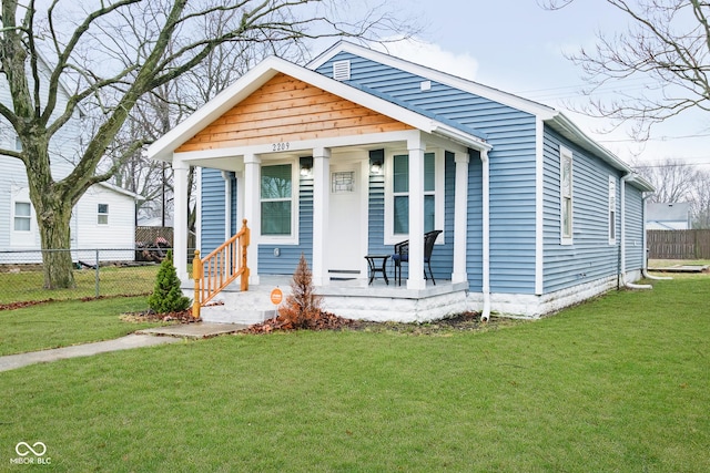 2209 W 9th St, Muncie, IN 47302 - shotgun-style home featuring a porch