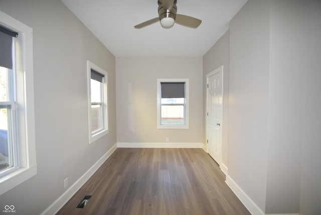 4231 Carrollton Ave, Indianapolis, IN 46205 - empty room featuring wood finished floors, ceiling fan, and baseboards