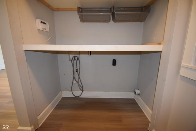 4231 Carrollton Ave, Indianapolis, IN 46205 - laundry room featuring hookup for a washing machine, wood finished floors, and baseboards