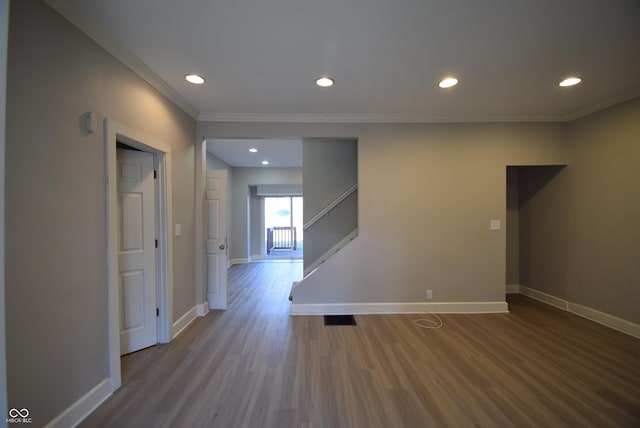 4231 Carrollton Ave, Indianapolis, IN 46205 - empty room featuring baseboards, wood finished floors, crown molding, and recessed lighting
