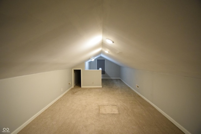 4231 Carrollton Ave, Indianapolis, IN 46205 - bonus room with vaulted ceiling, light colored carpet, and baseboards