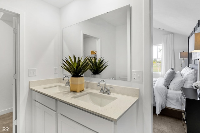 15387 Alperton Rd, Fishers, IN 46037 - full bath featuring double vanity, connected bathroom, vaulted ceiling, and toilet