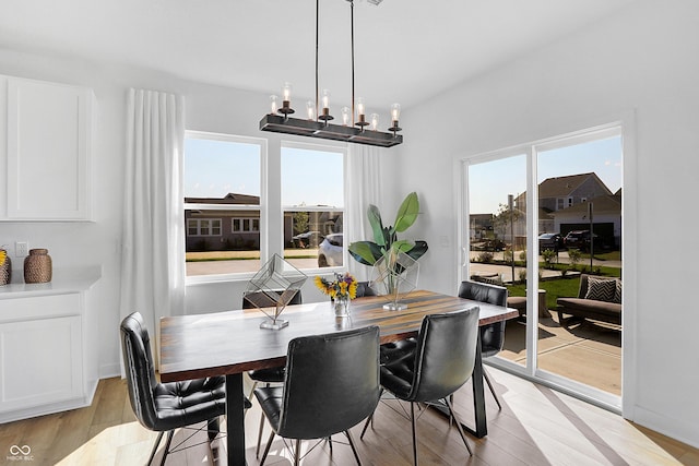 15387 Alperton Rd, Fishers, IN 46037 - dining area with a chandelier and light wood finished floors