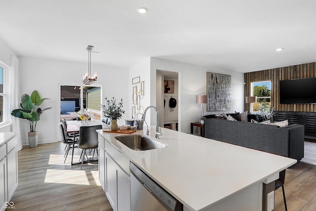 15387 Alperton Rd, Fishers, IN 46037 - kitchen with a sink, stainless steel dishwasher, light wood-type flooring, light countertops, and recessed lighting
