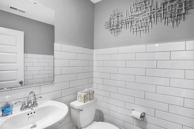 15387 Alperton Rd, Fishers, IN 46037 - bathroom featuring a sink, tile walls, and toilet