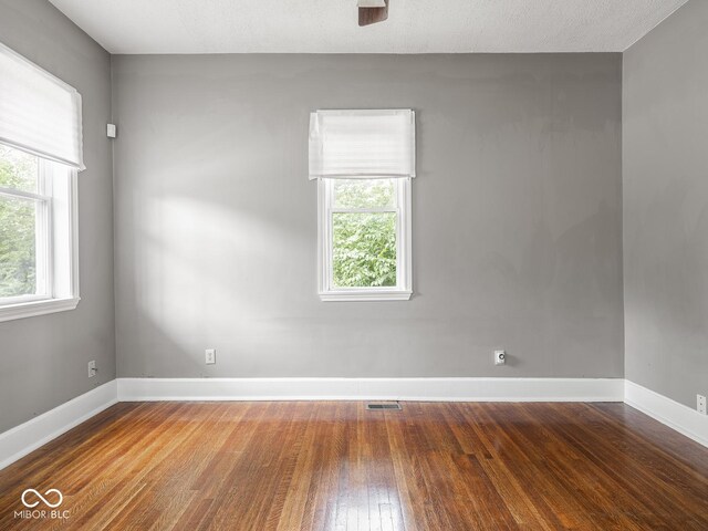 914 English Ave, Indianapolis, IN 46203 - unfurnished room with hardwood / wood-style floors, baseboards, and a ceiling fan