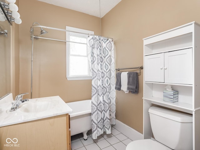 914 English Ave, Indianapolis, IN 46203 - bathroom with toilet, shower / tub combo, vanity, tile patterned floors, and baseboards