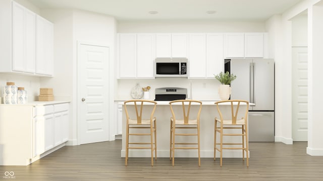 15395 Alperton Rd, Fishers, IN 46037 - kitchen featuring freestanding refrigerator, stove, light wood-style flooring, and white cabinets
