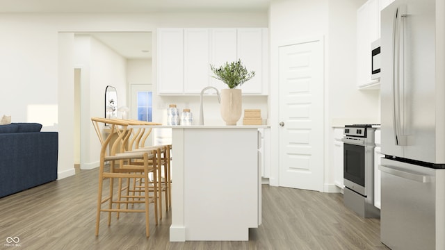 15395 Alperton Rd, Fishers, IN 46037 - kitchen featuring white appliances, light wood-style floors, a breakfast bar, white cabinetry, and light countertops