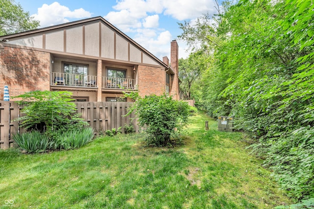 2267 Rome Dr Unit A, Indianapolis, IN 46228 - back of property featuring a chimney and brick siding