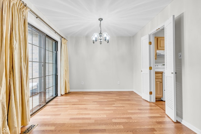 2267 Rome Dr Unit A, Indianapolis, IN 46228 - unfurnished dining area with a chandelier and light wood-style flooring