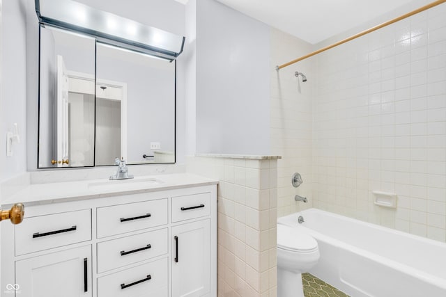 2267 Rome Dr Unit A, Indianapolis, IN 46228 - bathroom with vanity, tub / shower combination, tile walls, and a wainscoted wall