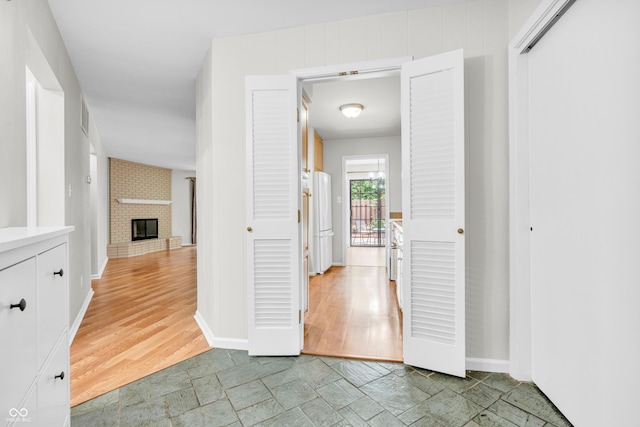 2267 Rome Dr Unit A, Indianapolis, IN 46228 - hall featuring baseboards and light stone finish floors