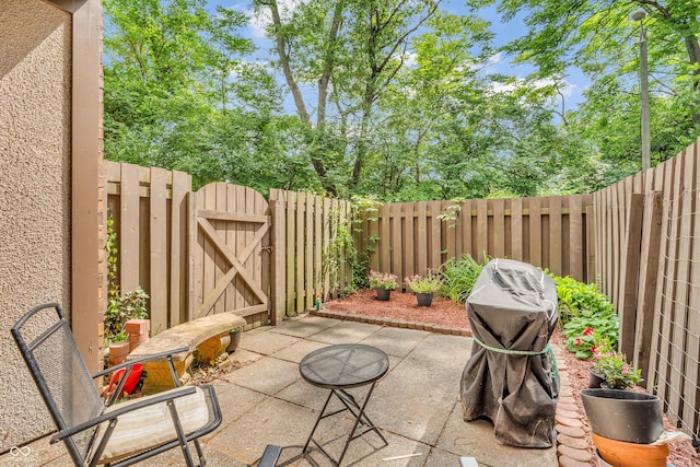 2267 Rome Dr Unit A, Indianapolis, IN 46228 - fenced backyard featuring a gate and a patio area