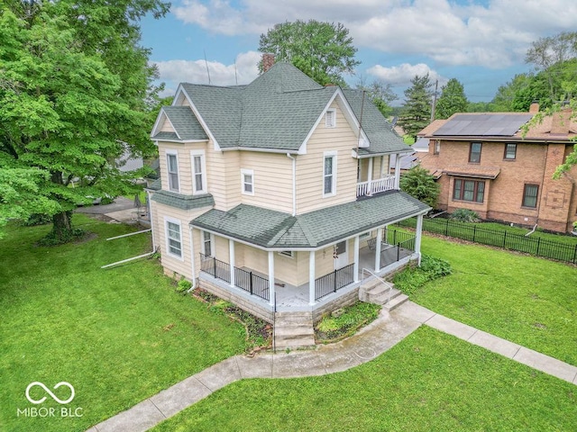 4526 Iowa St, Clayton, IN 46118 - view of front of property with roof with shingles, covered porch, a balcony, and a chimney