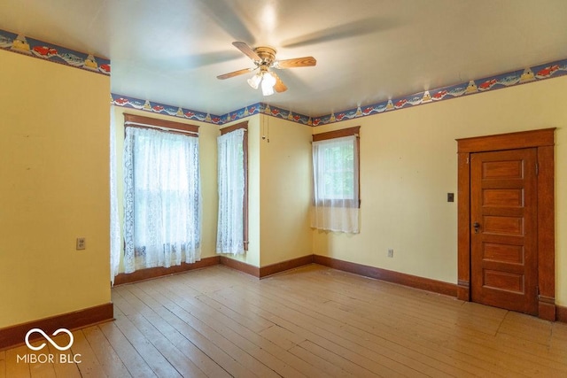 4526 Iowa St, Clayton, IN 46118 - spare room featuring ceiling fan, plenty of natural light, baseboards, and wood-type flooring