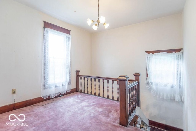 4526 Iowa St, Clayton, IN 46118 - bedroom featuring a chandelier, carpet flooring, and baseboards