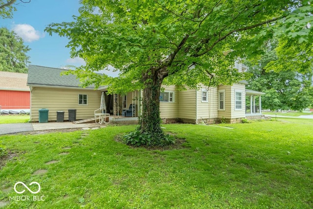 4526 Iowa St, Clayton, IN 46118 - view of green lawn featuring a patio area