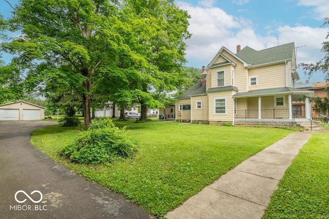 4526 Iowa St, Clayton, IN 46118 - view of front facade with a chimney, a porch, a garage, a front yard, and roof with shingles