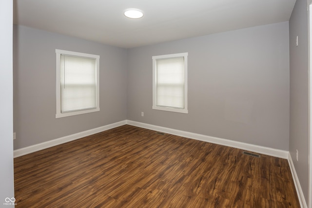 4933 W 13th St W, Speedway, IN 46224 - unfurnished room featuring baseboards and dark wood-type flooring