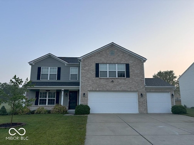 1287 Highland Lake Way, Brownsburg, IN 46112 - traditional-style house featuring concrete driveway, brick siding, a front lawn, and a garage