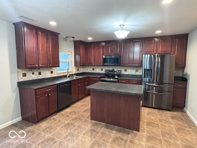 1287 Highland Lake Way, Brownsburg, IN 46112 - kitchen with appliances with stainless steel finishes, dark countertops, a sink, decorative backsplash, and baseboards