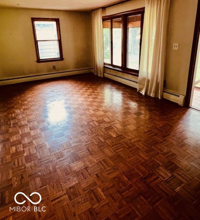3824 Forest Ridge Dr, Fort Wayne, IN 46804 - empty room with a baseboard radiator, healthy amount of natural light, and baseboards
