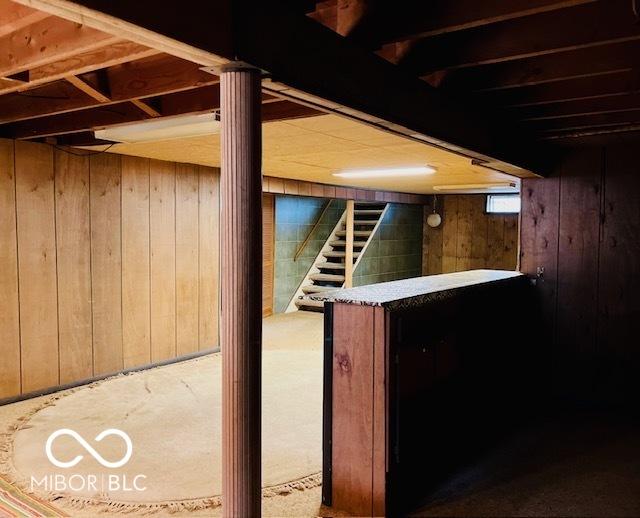 3824 Forest Ridge Dr, Fort Wayne, IN 46804 - below grade area featuring wooden walls and stairs