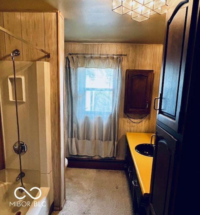 3824 Forest Ridge Dr, Fort Wayne, IN 46804 - bathroom featuring wooden walls, vanity, and bathing tub / shower combination