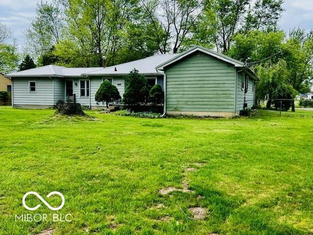 3824 Forest Ridge Dr, Fort Wayne, IN 46804 - back of property featuring a lawn and metal roof