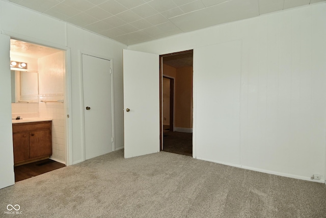 2622 Ethel Ave, Indianapolis, IN 46208 - unfurnished bedroom with carpet flooring, a sink, and ensuite bath