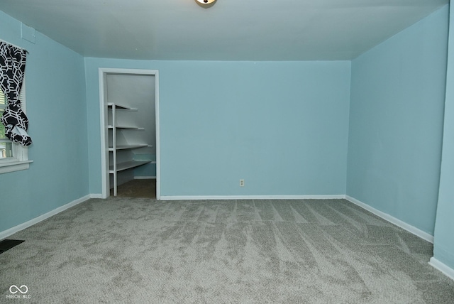 2622 Ethel Ave, Indianapolis, IN 46208 - unfurnished bedroom with carpet floors, baseboards, and a spacious closet