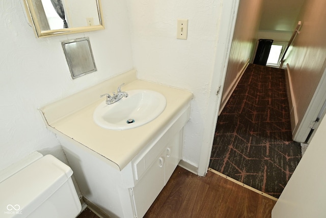 2622 Ethel Ave, Indianapolis, IN 46208 - bathroom featuring vanity, toilet, wood finished floors, and baseboards