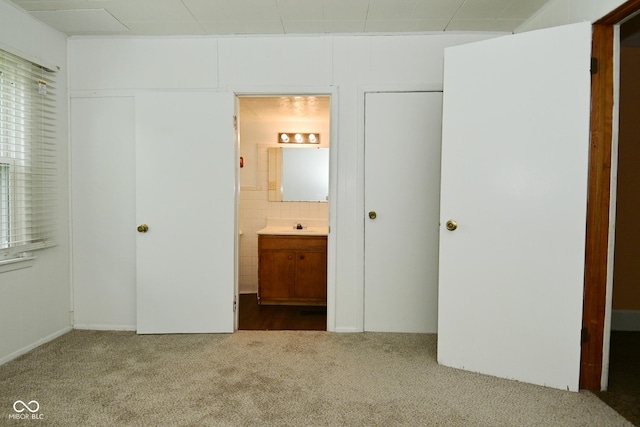 2622 Ethel Ave, Indianapolis, IN 46208 - unfurnished bedroom with carpet floors, a sink, and ensuite bathroom