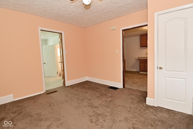 2622 Ethel Ave, Indianapolis, IN 46208 - carpeted empty room with a textured ceiling, a ceiling fan, and baseboards