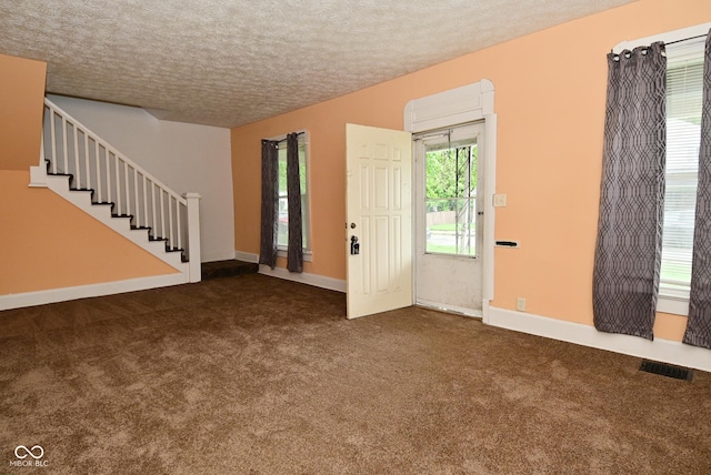 2622 Ethel Ave, Indianapolis, IN 46208 - entrance foyer with carpet flooring, a textured ceiling, stairway, and baseboards
