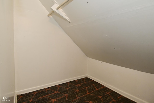 2622 Ethel Ave, Indianapolis, IN 46208 - spacious closet featuring dark carpet and vaulted ceiling