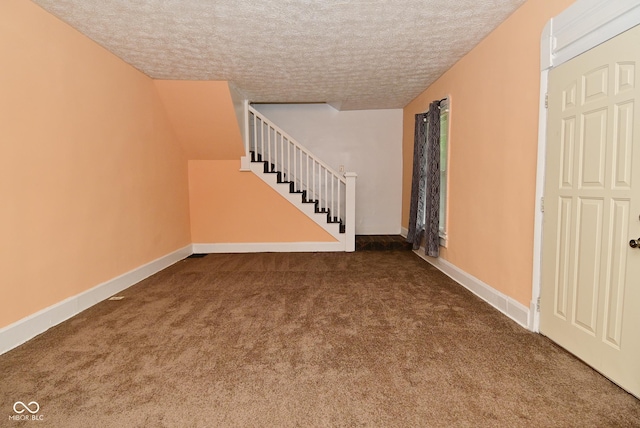 2622 Ethel Ave, Indianapolis, IN 46208 - unfurnished living room featuring carpet flooring, stairs, a textured ceiling, and baseboards