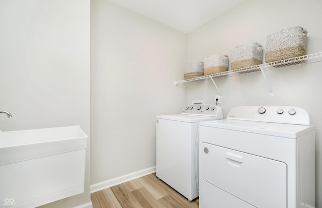 600 Dalton Way, Avon, IN 46123 - washroom with washing machine and dryer, light wood finished floors, and baseboards