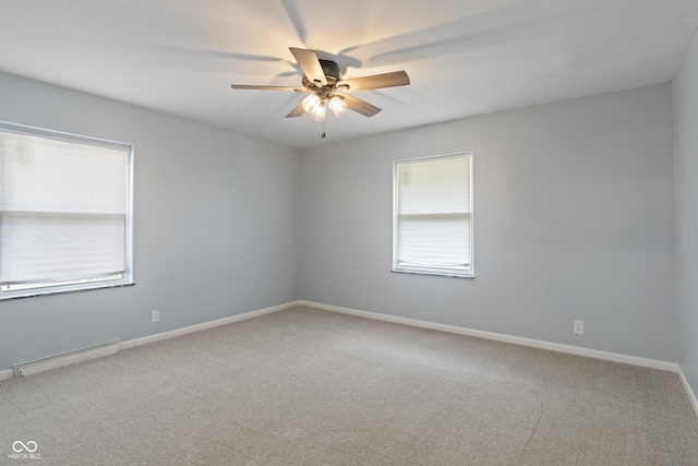 3735 Marrison Pl, Indianapolis, IN 46205 - empty room featuring a baseboard heating unit, a ceiling fan, carpet floors, and baseboards