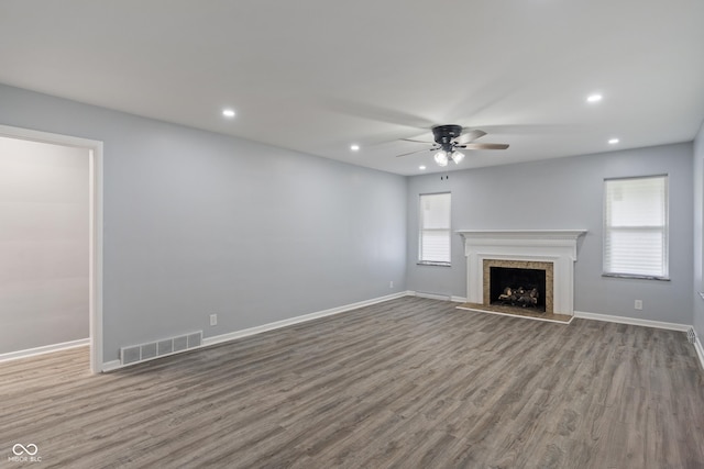 3735 Marrison Pl, Indianapolis, IN 46205 - unfurnished living room featuring a ceiling fan, wood finished floors, recessed lighting, baseboards, and a fireplace