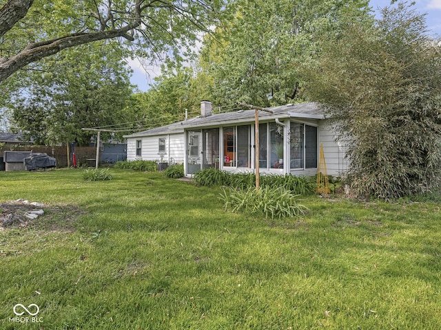 4305 Clinton St, Lawrence, IN 46226 - view of yard featuring a sunroom