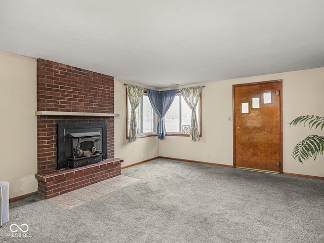4305 Clinton St, Lawrence, IN 46226 - unfurnished living room with carpet, baseboards, and a brick fireplace