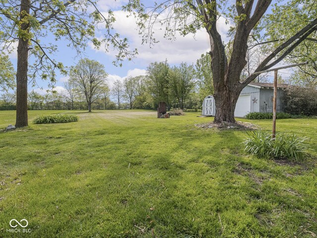4305 Clinton St, Lawrence, IN 46226 - view of green lawn with a garage