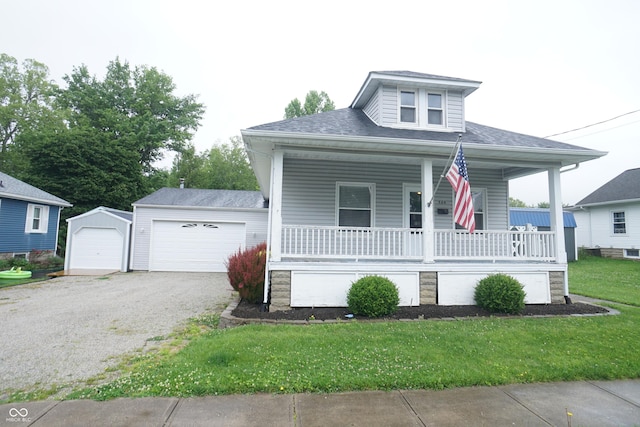 524 Hoene Ave, Batesville, IN 47006 - bungalow featuring a porch, a garage, a front lawn, roof with shingles, and driveway