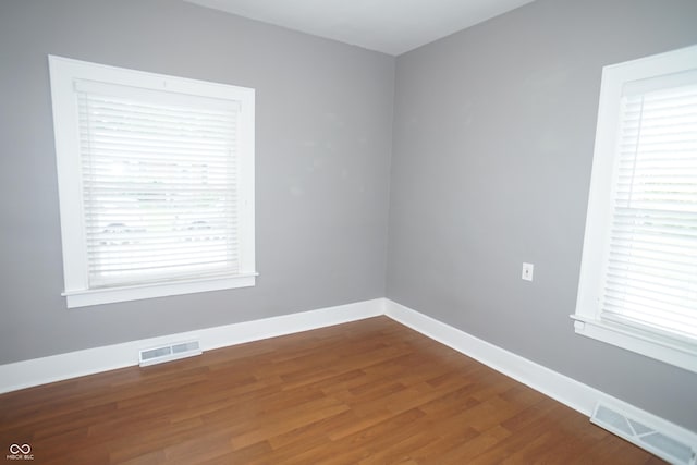 524 Hoene Ave, Batesville, IN 47006 - empty room with wood finished floors, plenty of natural light, and baseboards